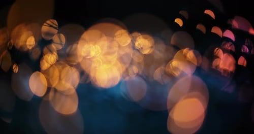 Abstract Bokeh Lights Floating on Dark Background