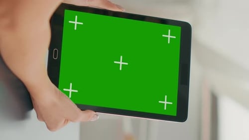 Vertical Video Freelancer Woman Holding Tablet Computer with Mock Up Green Screen