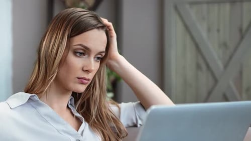 Close Up Face of Thoughtful Business Female Work at Notebook