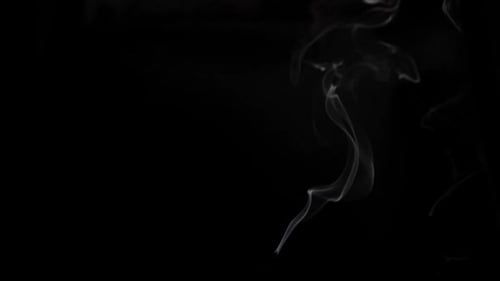 Wispy White Smoke Rising on a Black Background