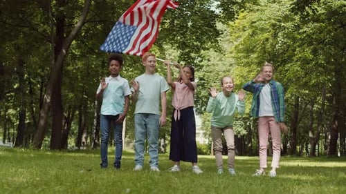 Children with American Flag in Green Park Waving