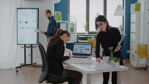 Team Analyzes Financial Data in a Modern Office