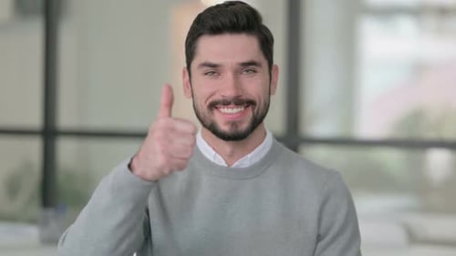 Smiling Man Giving Thumbs Up Gesture