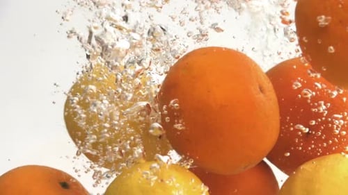 Orange And Lemon Dropping Water