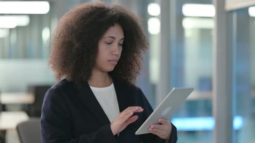 Portrait of African Businesswoman Using Tablet in Office