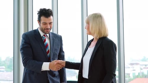 Business People Handshake with Friend at Office