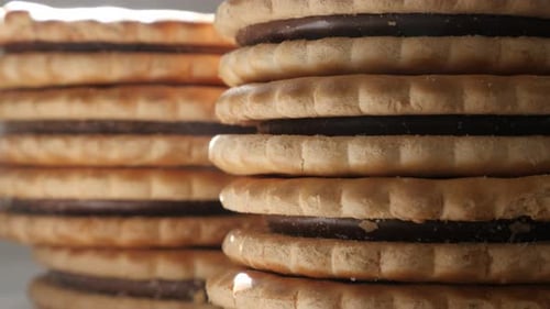 Filled with chocolate sandwich cookies close-up slow tilt 4K 2160p 30fps UltraHD footage - Sandwich