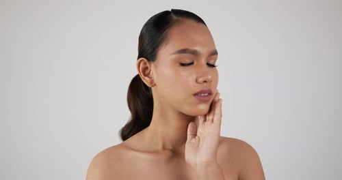 Woman Applying Moisturizer, Elegant Beauty Treatment