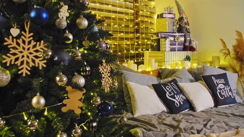 Christmas Interior Room Fireplace, Christmas Tree, Green Chair with a Red Blanket and Gifts