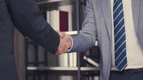 Business Handshake in Modern Office Environment