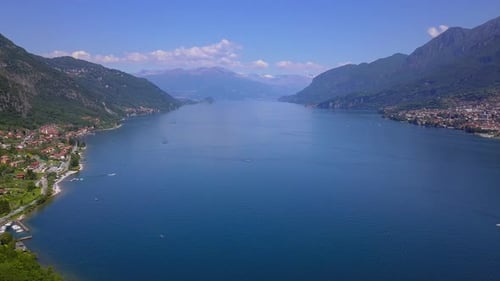 Aerial Flying Over Mountain Lake Como in North of Italy, Lot of Lakeside Villages, Sunny Weather