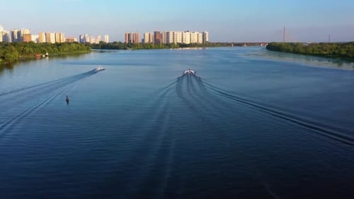 Aerial Back View of Boats Moving on the River