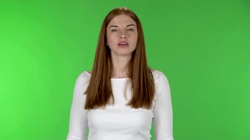 Smiling Woman Waving on Green Screen Background