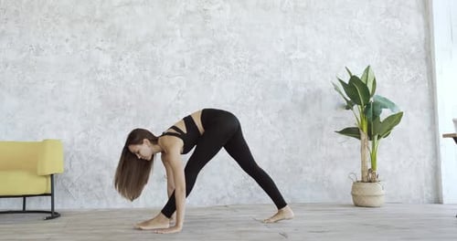 Woman Doing Yoga Stretch at Home