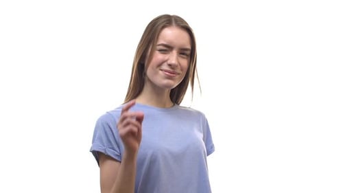 Happy Woman Winking and Pointing at Camera