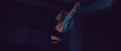 Couple Dancing in a Dark Urban Setting at Night