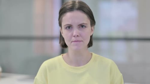 Woman Stares Directly Into the Camera Close Up