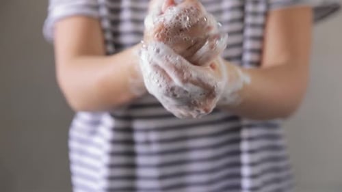 Women washing her hands to prevent pandemic virus infection and clean dirty hands. Close Up, 50fps.