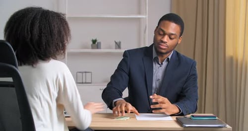 Unrecognizable Businesswoman Curlyhaired Lady Office Worker Gives Money Banknotes Salary to Ethnic