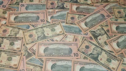 10 Dollars Banknotes On The Table