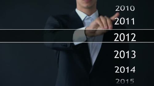 Businessman Selects 2017 Year in Virtual Menu Search for Data Business History