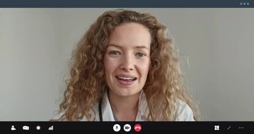Woman Doctor Smiling During Video Call