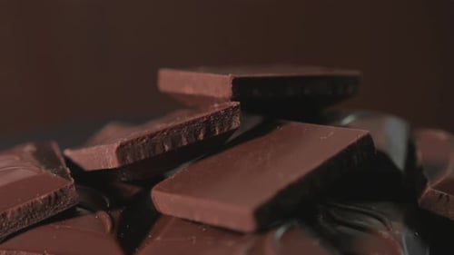 Squares of Rich Chocolate Stacked in Delicious Pile