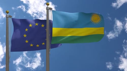 European Union and Rwanda Flags Waving Together in Sky
