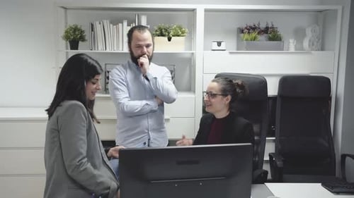 Team Discussing Business in Modern Office