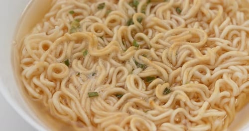 Close up of Delicious Ramen Noodles with Herbs