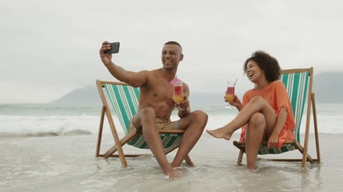 Couple enjoying free time by the sea
