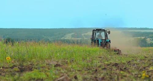 Agricultural Work in the Field the Tractor Plows the Land