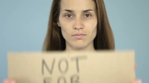 Not for Sale on Poster in Confident Woman Hands, Human Trafficking Prevention
