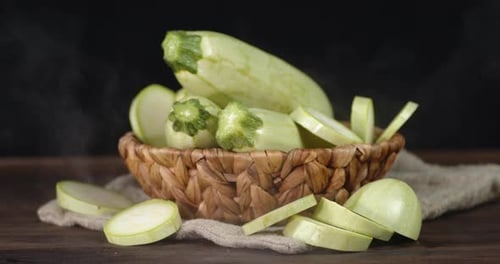 Fresh Sliced Zucchini in Rustic Woven Bowl