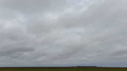 Cloudy Sky Over Field