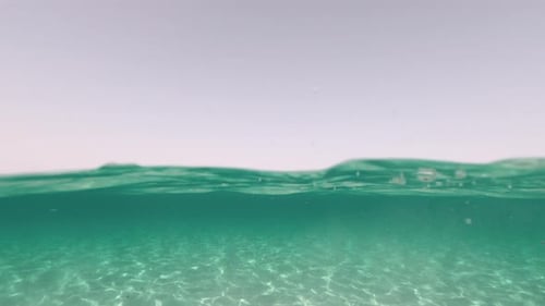 Blue sea ocean water and underwater scene. Waves and sky. Concept of summer holiday vacation