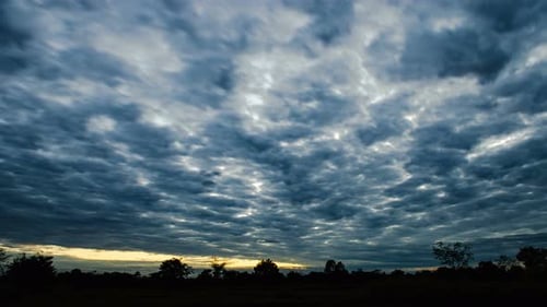Wispy Clouds Moving in Time Lapse at Sunset