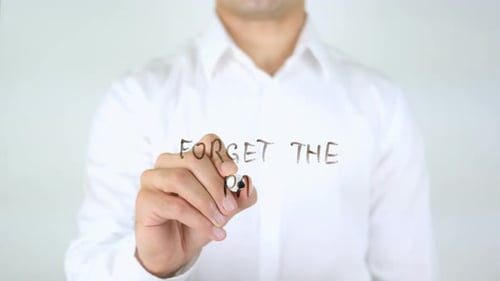 Man Writes 'Forget the Past' on Clear Surface