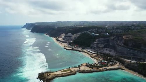 Aerial drone shot tourism of tropical coastline beach voyage by blue water with clean sandy backgrou