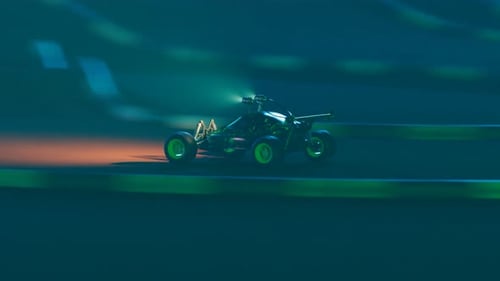 RC Car race on the sandy track. Loopable animation of a miniature model of buggy