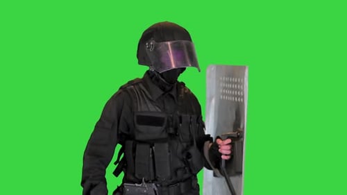 Riot Police Unit in Armor Baton Protective Shield Walking on a Green Screen Chroma Key