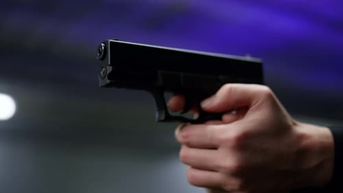 Close Up of Hand Holding a Handgun