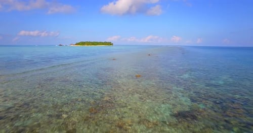 Aerial drone view of a scenic tropical island in the Maldives