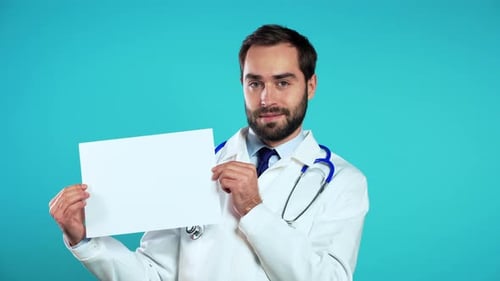 Portrait of Man in Medical Coat Holding White Horizontal Paper Isolated on Blue