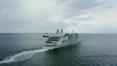Aerial View of a Cruise Ship Sailing on the Ocean or Sea in Cloudy Weather