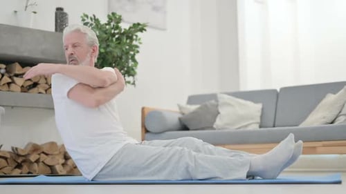 Senior Man Doing Seated Torso Twists for Flexibility