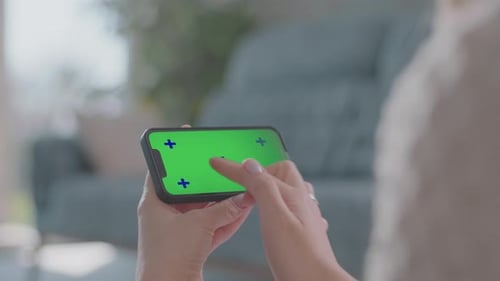 Woman Holding Smart Phone With Green Screen Close Up