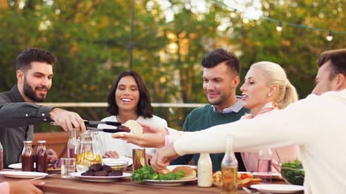 Friends Enjoying Outdoor Meal Together