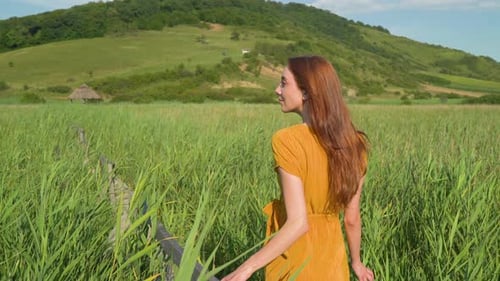 Woman in a reed field