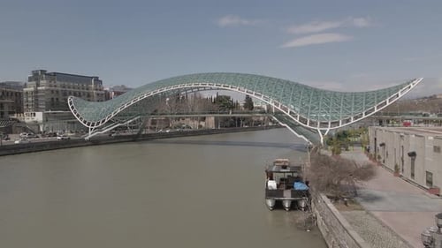 Tbilisi, Georgia - April 2 2021: Aerial view of Tbilisi city central park and Bridge of Peace.